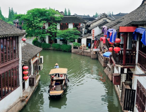 Old village by river in Shanghai with boat
